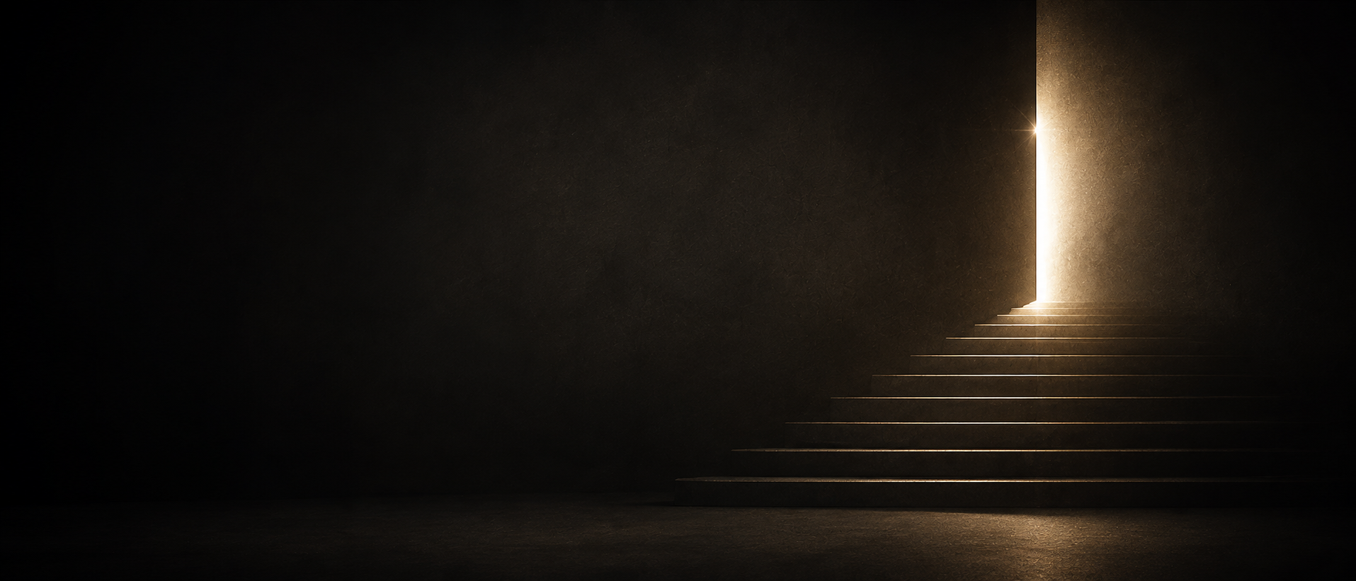 A staircase ascending toward an illuminated doorway